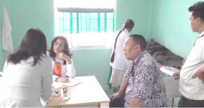 Dr. Suparna Nirgudkar and other healthcare personnel consulting with patients during the ongoing free medical camp in Naga Hospital in Kohima town on March 25. (DIPR)