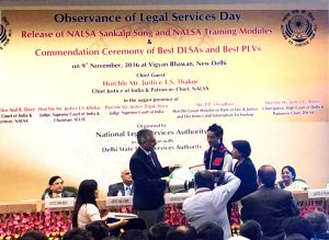 B Yemlong Chaba, Para Legal Voulunteer (PLV) and along with the Member Secretary of Nagaland State Legal Services Authority (NSLSA) receiving certificates and mementoes from Chief Justice of India.