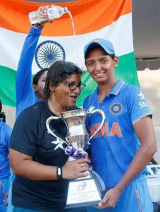 Indian Women cricket captain Harmanpreet Kaur (R) celebrates with the trophy after winning the Women's T20 Asia Cup final match against Pakistan  in Bangkok on Sunday. 