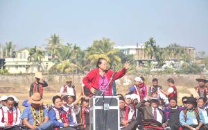 Tiala Sapu, formerly an intending candidate who withdrew from contesting the municipal and town council elections addressing the crowd, a section of it seen at the right, during a public rally called by the Joint Coordination Committee on Monday in Dimapur.