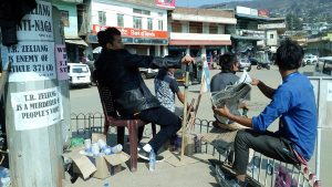 Youth volunteers enforcing the bandh in Wokha town on Friday, February at the Police Point in the town. 