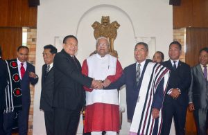 Newly elected Nagaland Chief Minister Dr. Shurhozelie Liezietsu (R)shake hand with former Chief Minister TR Zeliang as Nagaland Governor Padmanabha Acharya looks on during the sworn in ceremony at Kohima, Nagaland on Wednesday, 22 February 2017. 