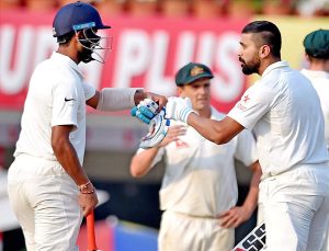 Two Indian not out  batsman M Vijay and C Pujara greets each other at the end of 2nd days plays of 3rd Test Match against Australia in Ranchi on Friday. 