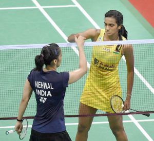  PV Sindhu greets Saina Nehwal after beating her in the quarterfinal match of the Yonex-Sunrise India Super Series badminton tournament at the Siri Fort Sports Complex in New Delhi on Friday.