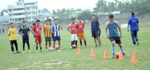 Students’ seen in action at the ongoing free grassroots football camp organised by NFCA on Monday at State Stadium, Dimapur.