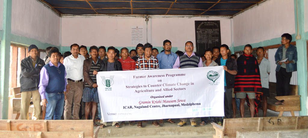 Officials of the ICAR-Nagaland and the KVK of Longleng district pose with farmers after a training event for the farming community on March 8 in Longleng district.  