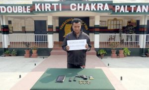 Ibomcha Khan  along with the seized arms and ammunition in Dimapur.