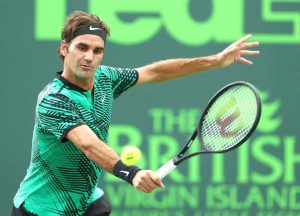 Roger Federer of Switzerland returns a shot against Frances Tiafoe during day 6 of the Miami Open at Crandon Park Tennis Center on March 25, 2017 in Key Biscayne, Florida.
