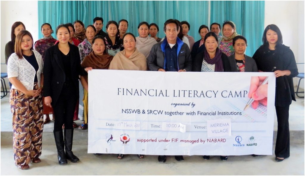 Participants, resource persons and organisers pose for a photograph after the seminar on financial literacy in Meriema village.