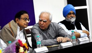 New Delhi: Former finance minister  P Chidambaram with senior Congress leader Kapil Sibal and former Planning Commission Deputy Chairman Montek Singh Ahluwalia at a seminar on "Untold Stories of Demonnetization - Its Impact on Indian Economy" organised by AICC Legal and Human Rights Department in New Delhi on Friday. PTI Photo by Subhav Shukla     (PTI3_3_2017_000217B)