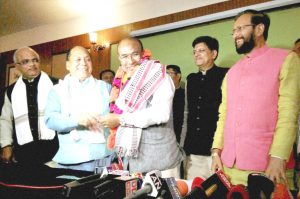 RE-TRANSMITTED ON 14-03-2017---------Imphal: Nongthombam Biren Singh is greeted after he was elected at BJP legislature party leader in Imphal on Monday.  Union Power Minister and BJP observer Piyush Goyal and HRD Minister Prakash Javadekar are also seen. PTI Photo   (PTI3_13_2017_000137B)