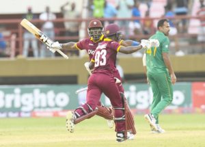 Wahab Riaz (R) of Pakistan walks off the field as Ashley Nurse (L) and Jason Mohammed (C) of West Indies celebrate winning the 1st ODI match between West Indies and Pakistan at Guyana National Stadium, Providence, Guyana, on April 7, 2017.