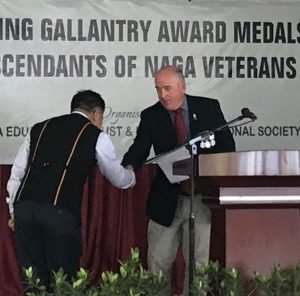 Curator Kohima Museum awarding one of the descendent of WW II