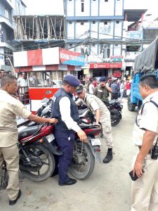 Kohima police penalise traffic defaulters