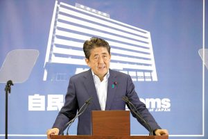 Abe wins upper house polls but falls short of majority for reform