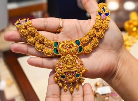 Gold, silver trade higher as easing crude and bond yields support precious metals